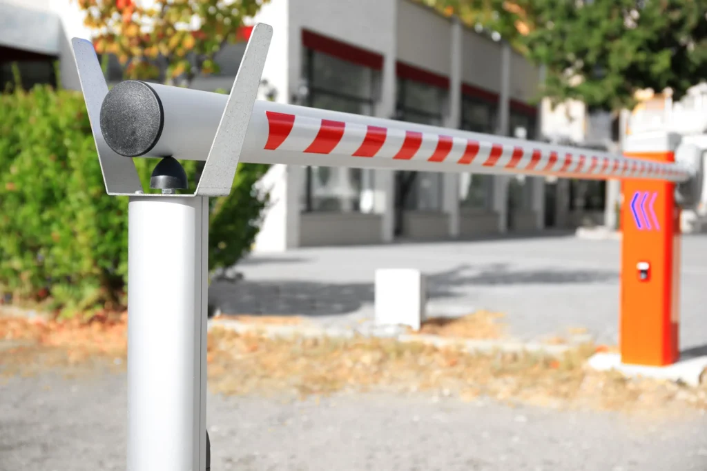 Automatic boom gate barrier with a red and