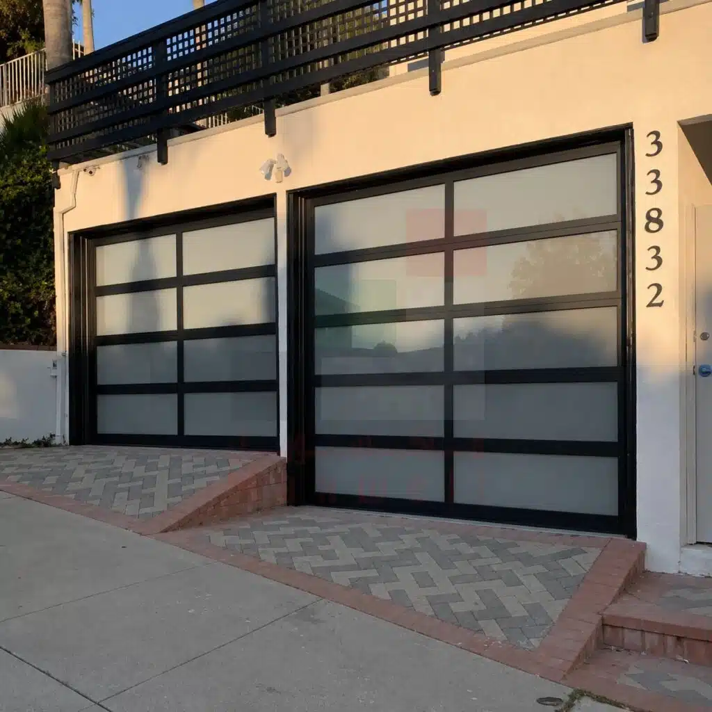Modern frosted glass garage doors with black frames, address 33832.