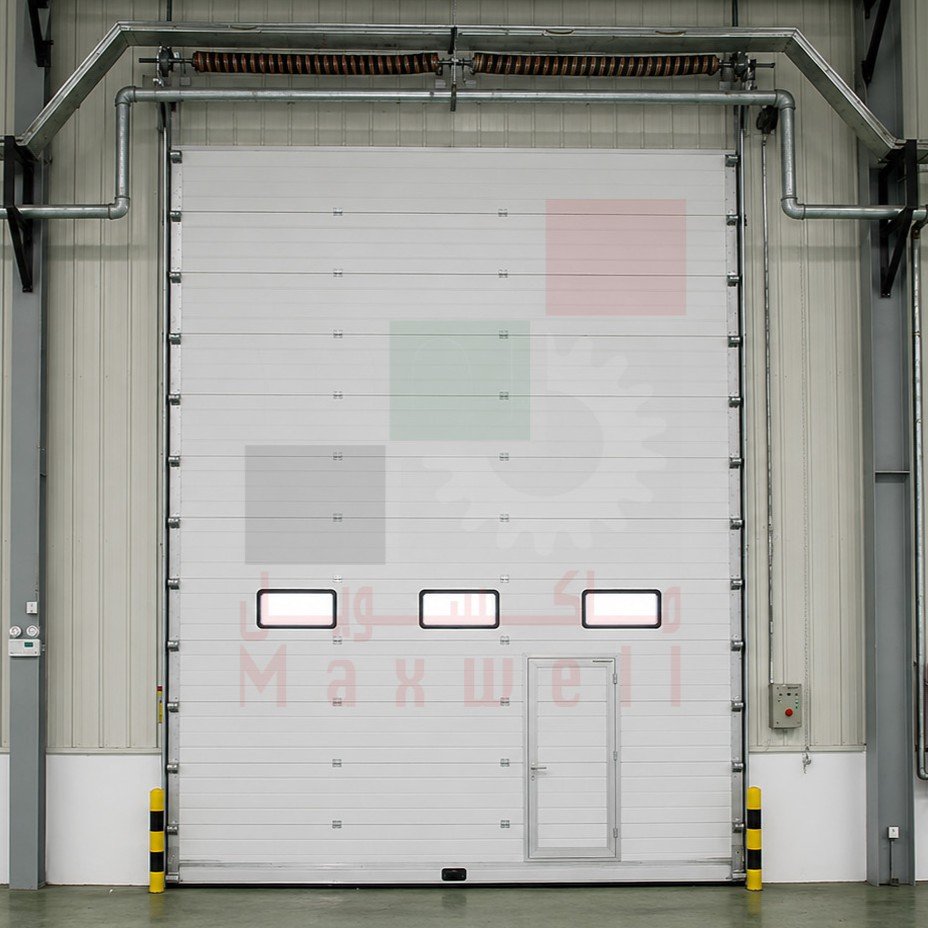 White sectional garage doors in Dubai warehouse, custom overhead